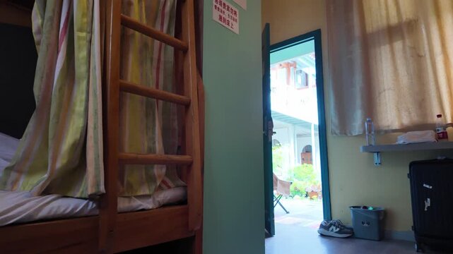 Inside a Youth Hostel Dorm Room in an Ancient City, Bunk Beds and Traveler Belongings Reflect Budget Travel Culture in China