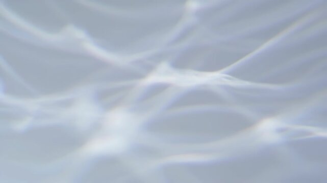 Abstract light waves on a soft blue background