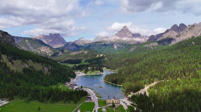Aerial drone view of Misurina Lake and Tre Cime di Lavaredo in the Dolomites, Italy. Stunning mountain landscape. 