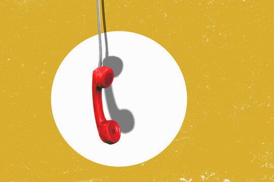 A red landline phone hangs by its cord; space available for text, isolated against a neutral background.