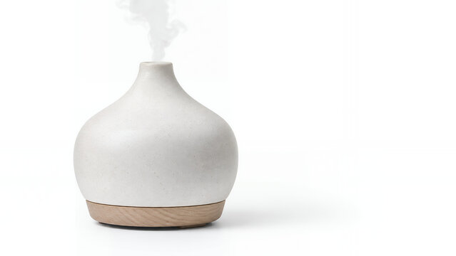Ceramic aromatherapy diffuser isolated on white with soft vapor