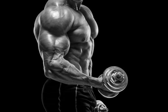 Muscular man working out with dumbbells, isolated. Strong male naked torso abs