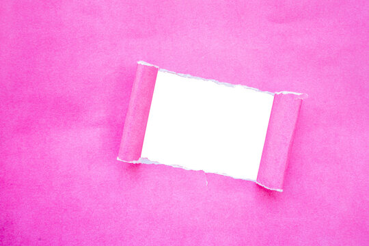 a hole in the middle of the pink cardboard