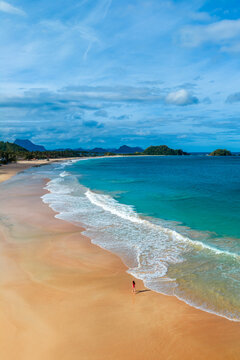 Aerial view of waves crashing on the shore of Nacpan beach on Palawan in the Philippines 