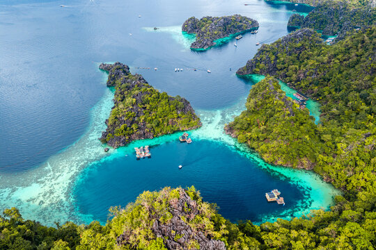 Aerial view of tropical islands of Coron in the Philippines with limestone cliffs and azure blue water lagoons