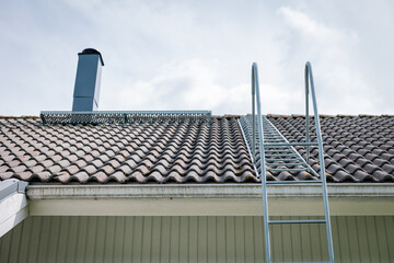 roof tiles, chimney and ladder © Marika