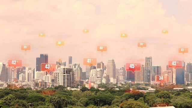 Modern city skyline experiencing an intense extreme heat wave and global warming with high temperature data location icons hovering over modern skyscrapers during hot summer climate crisis