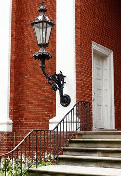Oversized outdoor lantern on classical building