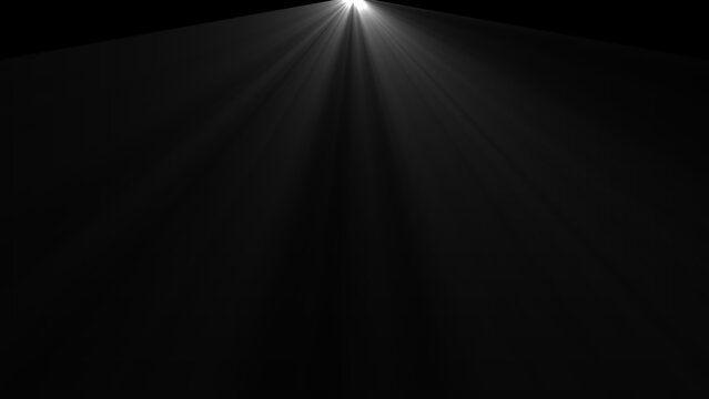 Spotlight beam with radiating light rays on a black background dramatic illumination effect