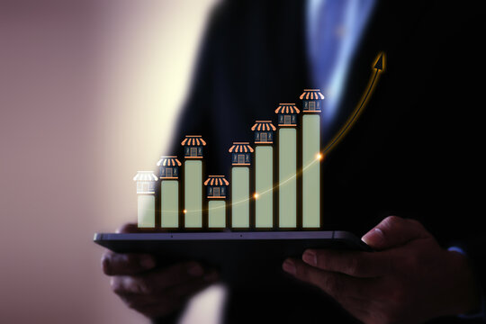 Businessman with franchise icon for goal to growth is investment planning financial and branch expansion and management bank loans for marketing franchising.
