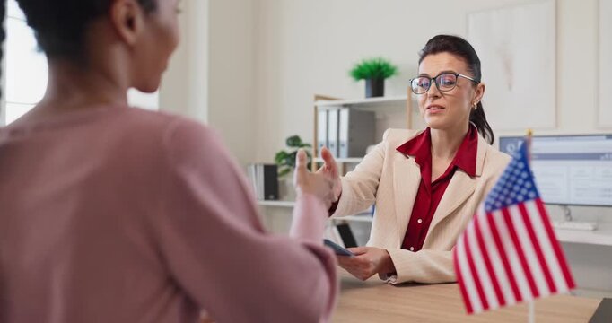 Immigration consultant reviews client documents for visa application. The counselor at a desk prepares for interview as a flag signals trust. Concept of interview appointment and legal guidance.
