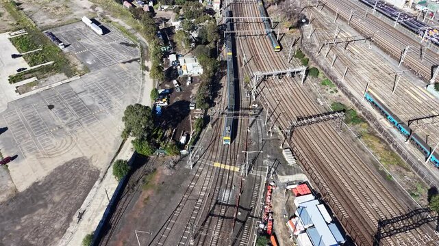 Aerial view of a commuter train traveling on railway tracks