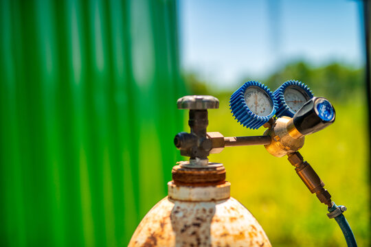 Industrial gas cylinders placed in building site for construction and fabrication tasks
