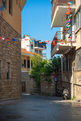 Fototapeta premium Narrow paved street with historic architecture in Kaleici old town Antalya Turkey