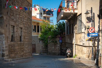 Fototapeta premium Narrow stone street with traffic signs in Kaleici old town Antalya Turkey