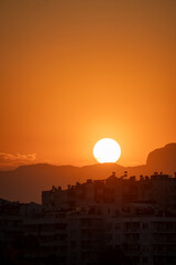 Fototapeta premium Vertical sunset view over Antalya city skyline and Taurus mountains Turkey