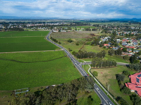 Floodplain farmland with road in Singleton seem from drone view
