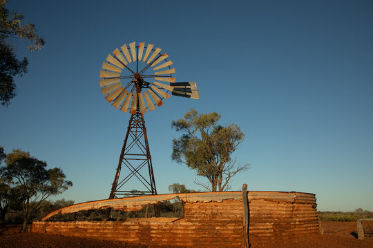 Old abandoned windmill and water storage tank