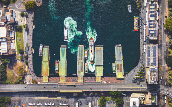 An aerial view of the wharves at Circular Quay, with ferries coming and going