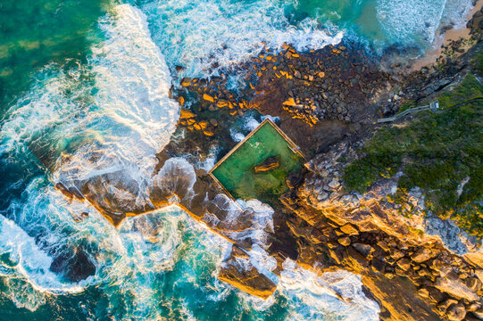 A overhead drone shot of North Curly rockpool after dawn