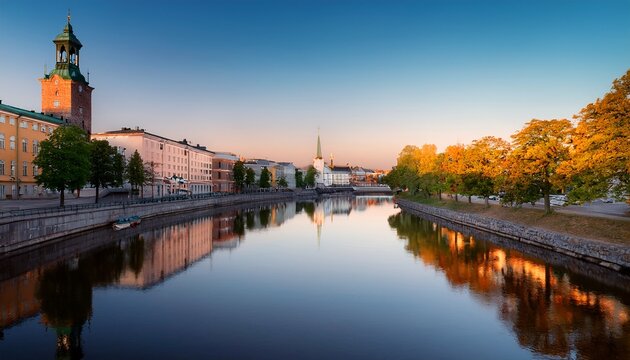 cityscape of turku finland at dawn and the calm aurajoki river in the city downtown