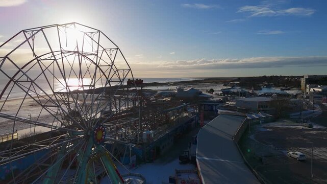 Aerial view of Ferris wheel at sunset. rural landscape, Wainfleet, Village, Skegness in morning sunrise wintertime.