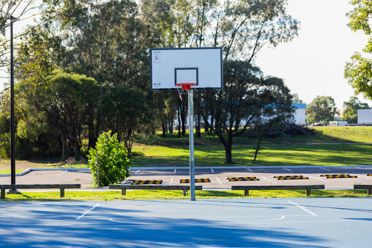 Basketball hoop at the end of a court in public park