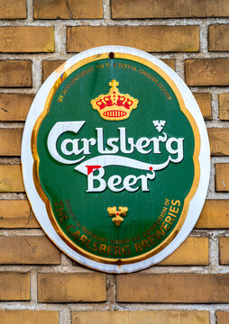 Kappeln, Germany, June 8, 2026 &ndash; Historic Carlsberg Beer enamel sign on a brick wall. A historic Carlsberg Beer sign highlights tradition, craftsmanship and the timeless appeal of vintage advertising.
