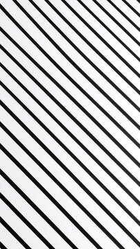 Diagonal black lines on a white surface create a bold, geometric pattern