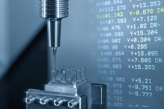 Abstract scene of a CNC milling machine cutting an electrode part with a ball nose end mill and G-code data background.