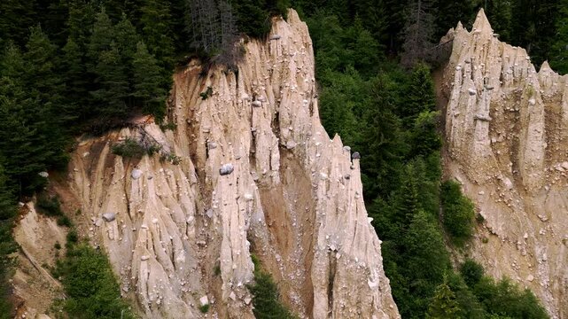 Piramidi di Plata view through forest in Italy by drone