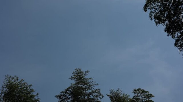 Bright sunny sky with flowing moving clouds captured via smooth time lapse for natural visual footage use
