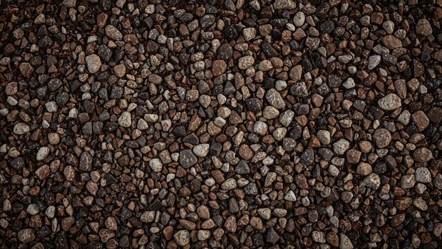 Close-up of small gravel stones scattered on the ground.