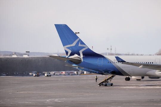 23 of Jnuary 2026 Air Transat aircraft parked on the apron at Montreal Trudeau Airport during winter operations. g.