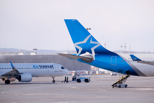 23 of Jnuary 2026 Air Transat aircraft parked on the apron at Montreal Trudeau Airport during winter operations. g.