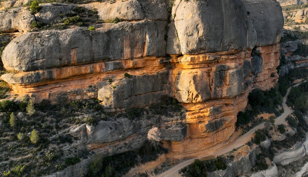 Aerial view of Margalef canyon at sunset with rocks and beautiful river.