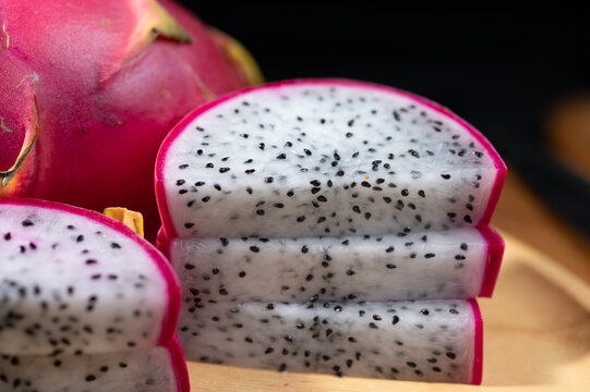 Fresh Dragon Fruit on Wooden Plate