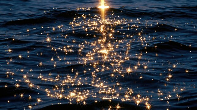 Sun glints sparkle across dark, rippling water surface