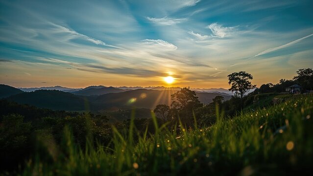 Sunset over rolling hills at dawn with beautiful sky and trees, scenic landscape.