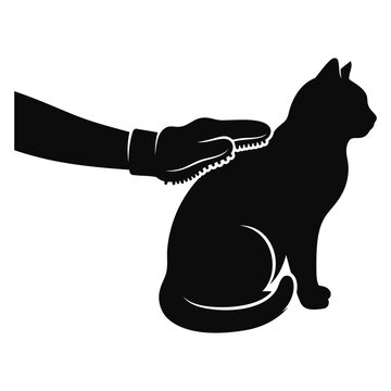 Silhouette of a hand wearing a grooming glove brushing a sitting cat