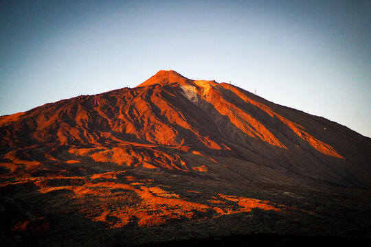 A volcano Teide and stunning mountains with lava formations at sunset/