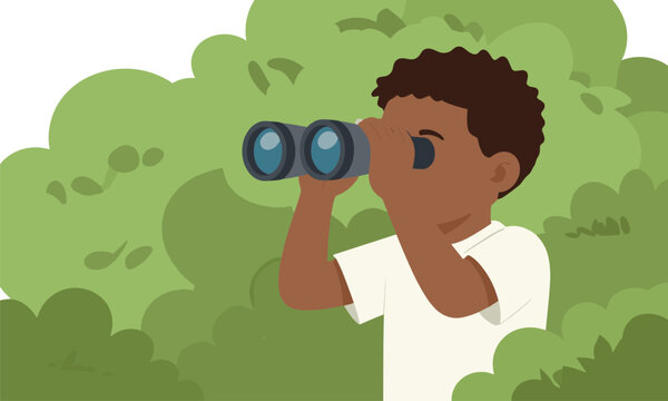 Curious young african american boy peeking from behind green bushes while looking through a pair of modern binoculars.