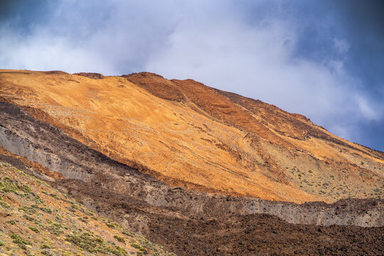 A volcanic landscape with desert and rocky mountains.