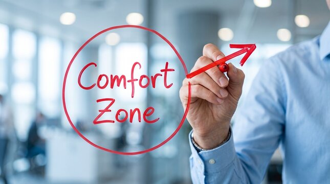 Comfort Zone concept with businessman drawing red arrow out of circle, personal growth and career development, stepping out of comfort zone in office