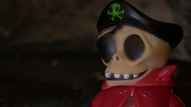 Qawra, Malta - 30.09.2024 - Spooky pirate Halloween candy packaging figure Woogie brand with light changing and smoke