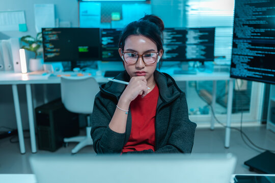 women software developer analyzing source code with a digital pen in a modern office, representing programming, software engineering, code review, debugging, technology, innovation, IT productivity.