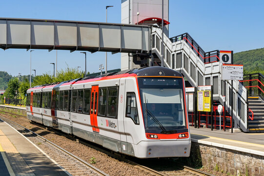 Taffs Well, Rhondda Cynon Taf, Wales, UK - 15 July 2026: Transport for Wales Class 398 Citylink tram train at Taffs Well railway station in south Wales. The train is manufactured by Stadler