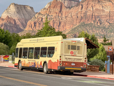 Springdale, Utah, USA - 26 June 2026: Zion National Park Shuttle bus operated by the National Park Service stopped at a bus stop in the town of Springdale