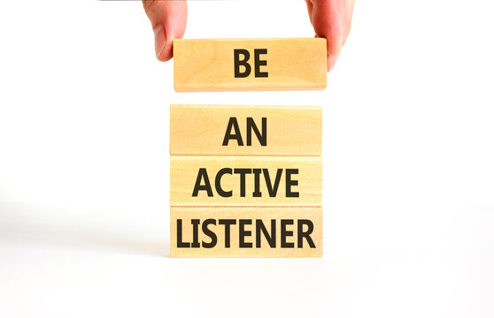 Be an active listener words symbol. Concept words Be an active listener on beautiful wooden blocks. Beautiful white background. Businessman hand. Business be an active listener concept. Copy space.