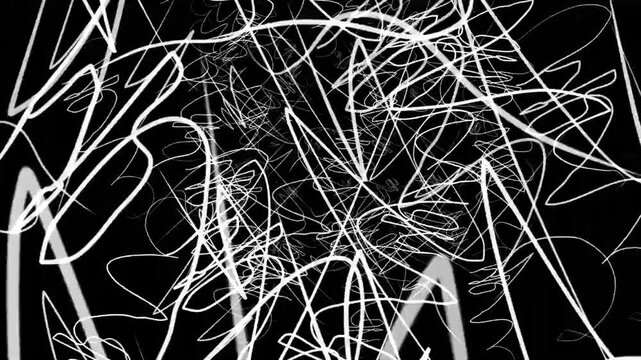 Abstract white scribbles on black background. Chaotic hand drawn doodle lines pattern.